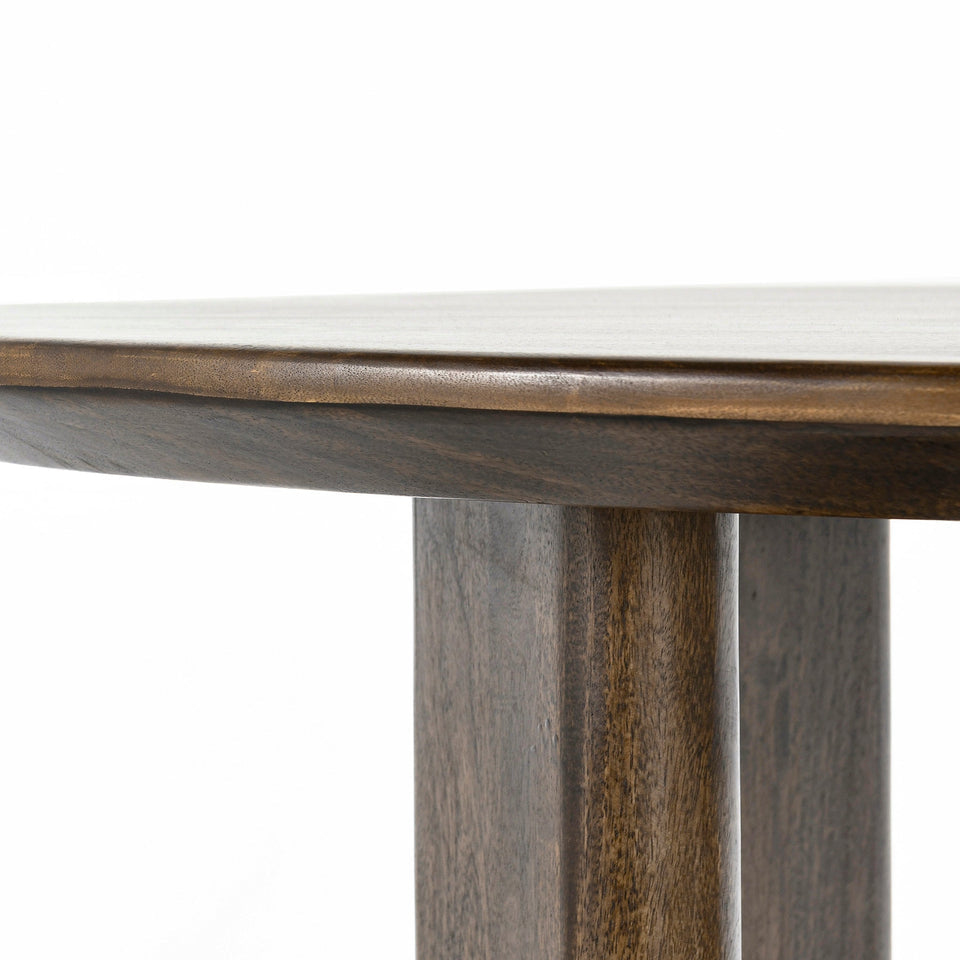 Round wooden table with a white marble top on a white background