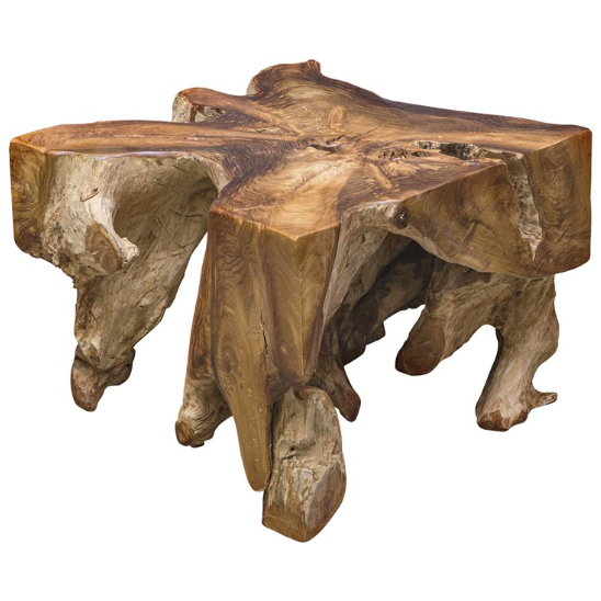 The Raiz Coffee Table is a rustic wooden coffee table crafted from a single piece of natural teak tree wood. It features an uneven tabletop with a star-like shape and visible grain patterns. The legs are rugged, irregular, and retain the natural form and texture of the wood, resulting in an organic and earthy aesthetic.