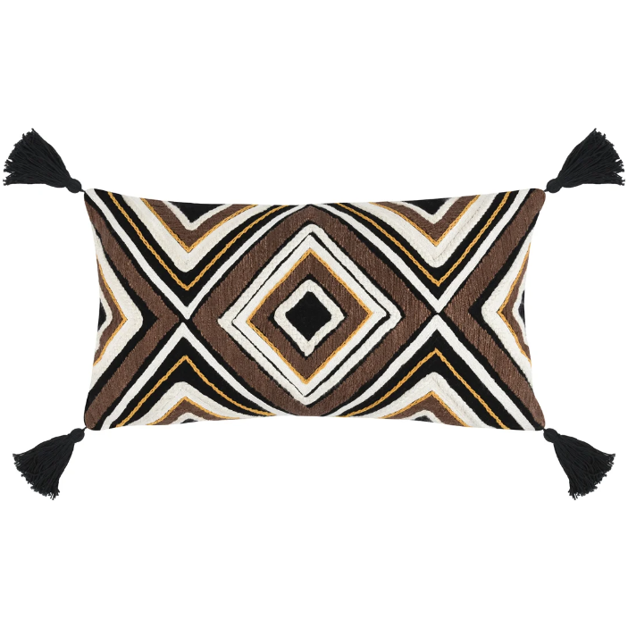 A decorative rectangular Chale Throw Pillow featuring a geometric pattern with zigzag and diamond shapes in brown, beige, and white colors, accented with black tassels on each corner.