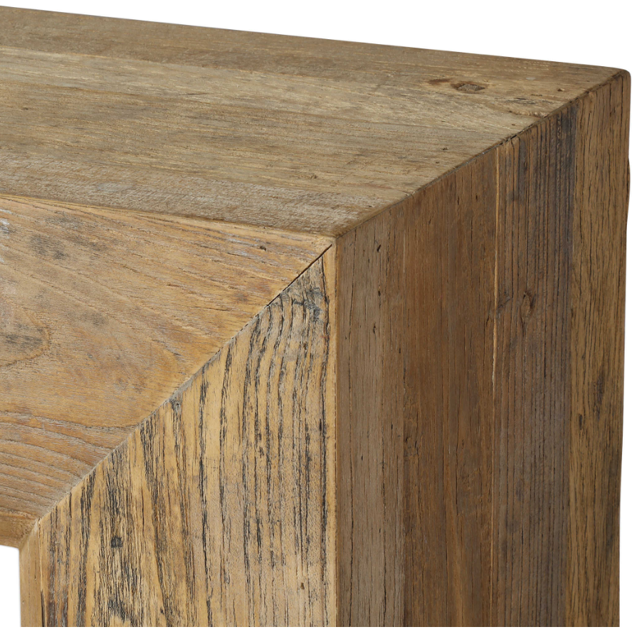 Close-up of the Ridge Console Table's corner, crafted from reclaimed elm wood. Visible grain, knots, and textured finish emphasize its handcrafted, rustic look and solid construction.