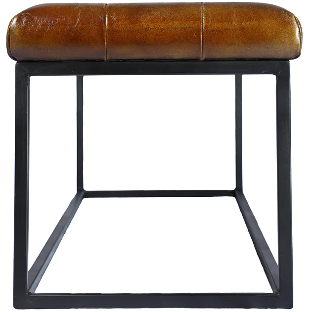 Introducing the Northwood Bench: a modern rectangular stool featuring a black metal frame and a brown button-tufted leather cushioned seat. The seat showcases a smooth, polished finish with visible stitching along the seams. Its open frame design forms a sleek cuboid shape, achieving a minimalist aesthetic.