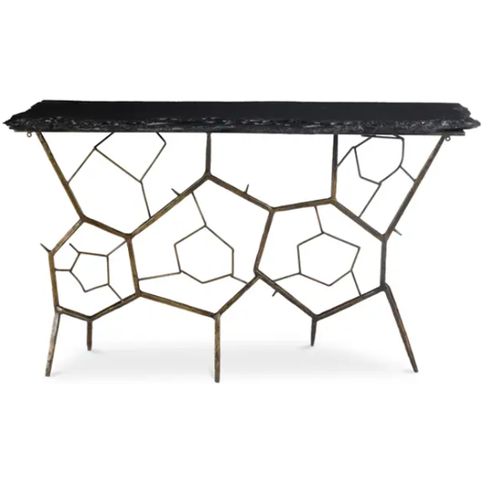 Introducing the Nathanial Slate Console Table, a marvel of modern design featuring a rectangular black marble top and an artistic base of interconnected, irregular geometric shapes with a bronze finish, reminiscent of a complex honeycomb pattern. The table is supported by multiple slender legs that seamlessly integrate into the geometric design.