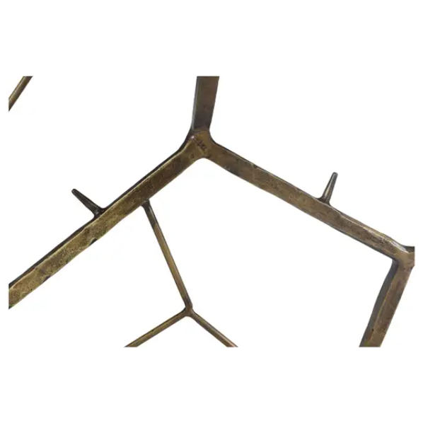 Close-up photo of the Nathanial Slate Console Table's bronze-colored metal frame featuring geometric lines and angles that form interconnected shapes. The modern design exhibits a slightly rough, weathered texture with visible seams and joints. There are no additional features visible in the background.
