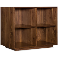The Soren Walnut Bookcase is a rectangular unit with walnut veneers, visible wood grain, and a simple modern design. It features two vertical compartments with one shelf each, providing four open storage spaces—ideal for modular desk setups.