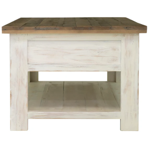 The Provence Coffee Table exudes rustic charm with its square shape, natural wood top, and distressed white base. Featuring sturdy legs, a lower shelf for storage, and a drawer made from reclaimed FSC pine, this table masterfully combines functionality with a farmhouse aesthetic.