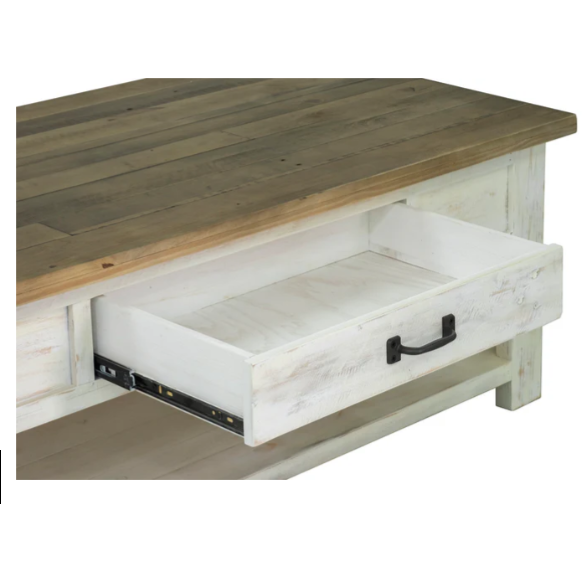 The Provence Coffee Table exudes rustic charm with its natural wood top and distressed white base. A partially open drawer reveals a spacious interior, complete with a dark metal handle for easy access. Constructed from reclaimed FSC pine, it also features a lower shelf for additional storage, enhancing both functionality and farmhouse style.