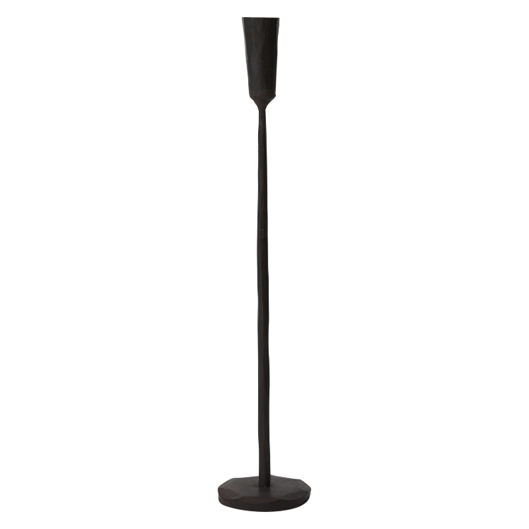 The Davina Black Candlestick is a tall, slender, black metal holder with a minimalist design. It features a sturdy circular base, a thin and straight stem, and a small cylindrical cup at the top to hold a single candle. The overall look combines modern elegance with rustic charm.