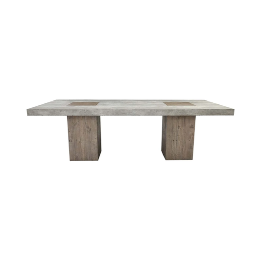 The Arizona Concrete 94" Dining Table is a rectangular, minimalist design featuring a thick, smooth concrete surface. Supported by two sturdy wooden block legs, it perfectly combines an industrial look with rustic elements. The light gray finish of the concrete top seamlessly blends durability and style.