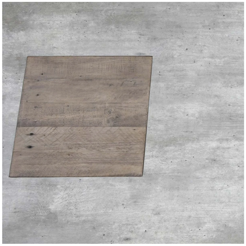 An Arizona Concrete 94" Dining Table sits on a light gray concrete floor. The table has a simple design with a natural wood finish, showing some wood grain texture and minor imperfections. The surrounding concrete floor appears smooth with a few subtle imperfections.