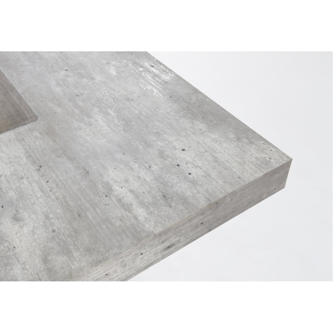 Close-up of a rectangular concrete slab with a smooth finish, displaying a slightly rough and mottled texture typical of an Arizona Concrete 94" Dining Table. The surface is light gray with fine sporadic dark spots; edges appear sharp and clean. The plain white background emphasizes the slab's texture and color.