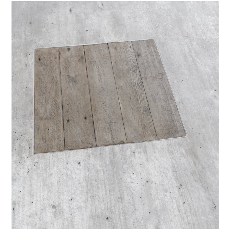 The Arizona Concrete 94" Dining Table features a surface composed of five vertically aligned planks of reclaimed pine, each with its own unique texture and grain pattern, resulting in a charming rustic aesthetic. The planks are set within a smooth, light gray concrete base that contrasts beautifully with the darker wood, giving the table a modern yet timeless appeal.