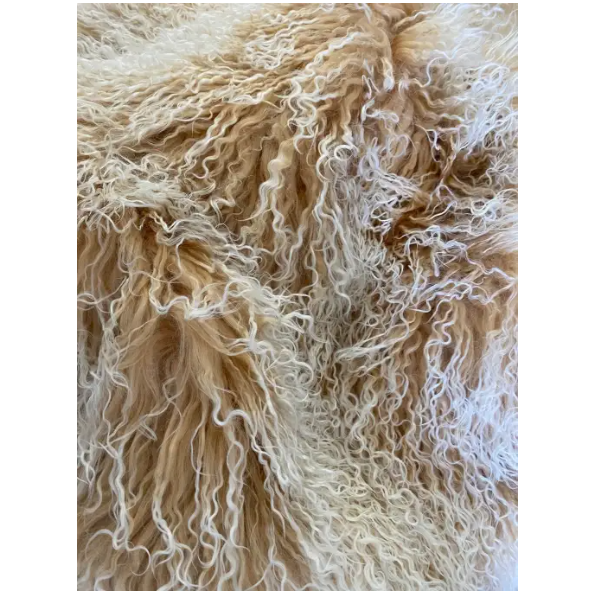 Close-up image of a soft, fluffy texture, showcasing curls and waves of beige and white fibers. The combination of colors and the intricate pattern suggests the surface of a luxurious Large Lamb Fur Throw, offering a sense of warmth and coziness.