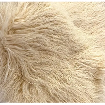 Close-up of the fluffy, woolly texture of the Small Lamb Fur Throw. The wool is light cream in color, with a soft, slightly curly appearance, creating a voluminous and cozy look. The fibers appear dense and intertwined, resembling luxurious Tibetan lamb fur for ultimate comfort and an inviting feel.