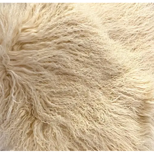 Close-up of the fluffy, woolly texture of the Small Lamb Fur Throw. The wool is light cream in color, with a soft, slightly curly appearance, creating a voluminous and cozy look. The fibers appear dense and intertwined, resembling luxurious Tibetan lamb fur for ultimate comfort and an inviting feel.