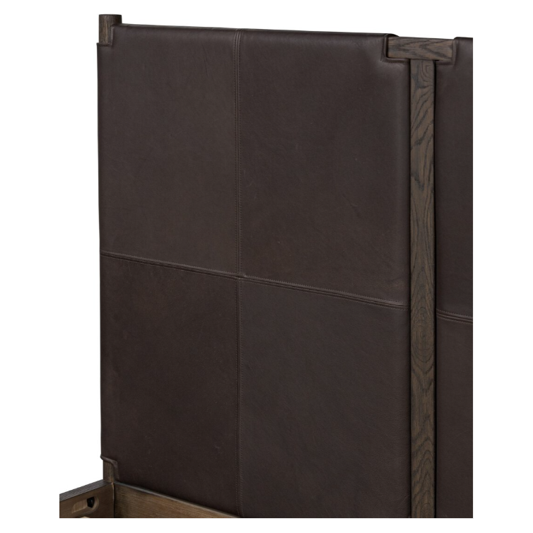 A detailed view of the Valencia Haven Bed's wooden frame headboard reveals a striking panel design. Showcasing safari-inspired elegance, its dark brown, upcycled leather upholstery features visible stitching and is divided into four distinct rectangular sections. The natural wood finish provides a stunning contrast to the luxurious texture.