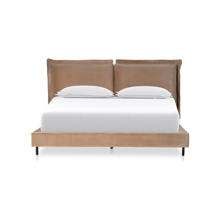 The Ashford Estate Bed exemplifies modern design with a light brown, cushioned headboard. Its sleek frame elegantly supports a white mattress and two pillows atop slender black legs. This piece elevates any room to a luxurious sanctuary, seamlessly combining contemporary style with comfort.