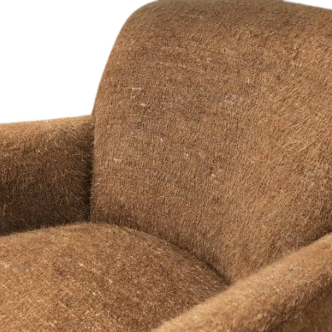 Close-up of the Sienna Luxe Custom Accent Chair, showcasing its plush cushions and textured fuzzy fabric on the backrest, armrest, and seat. The image highlights the upper left side of this stylish chair against a white background.