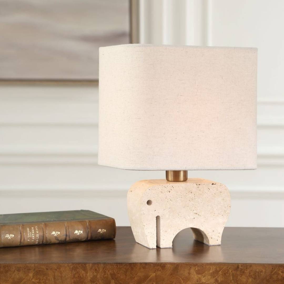Table lamp with a stone-like base on a wooden surface