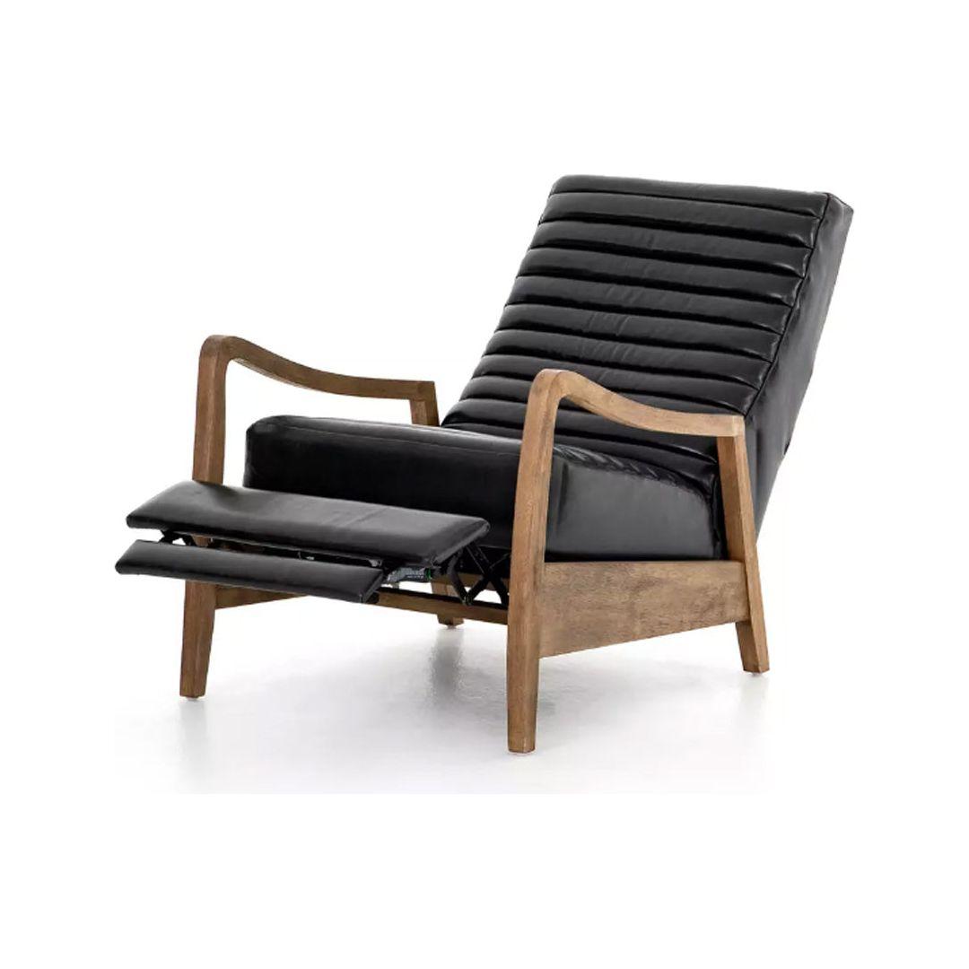 The Terra Leather Recliner, Black features a modern mid-century design with a wooden frame, slightly angled armrests, and black leather upholstery. Its extended footrest highlights the reclining function against a white background.