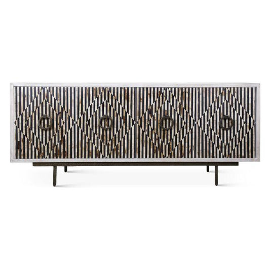 The Terra Noir Sideboard Media Cabinet is a long, rectangular piece crafted from horn and mango wood. Its doors feature a striking geometric pattern of diamonds within vertical stripes, creating textured elegance. Elevated on short metal legs, it embodies modern minimalism.