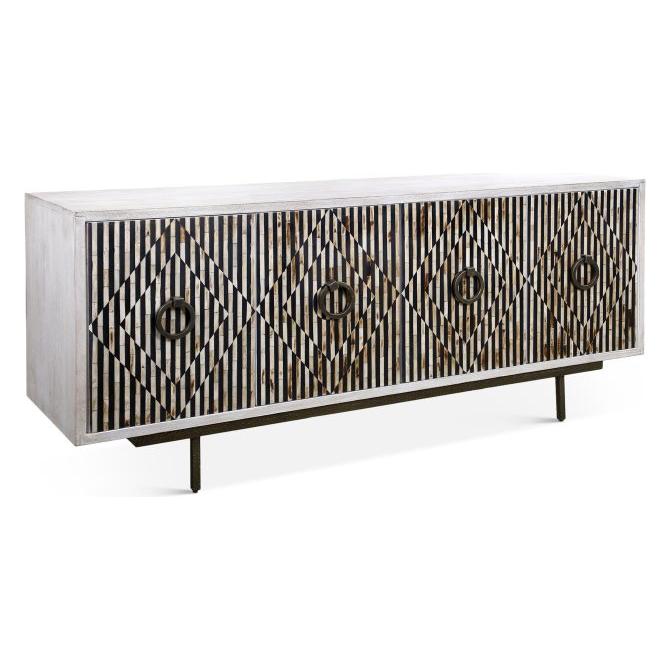 The Terra Noir Sideboard Media Cabinet showcases a modern geometric diamond pattern in vertical black and white stripes, crafted from horn and mango wood with a distressed white finish. It stands on four slim black metal legs, with circular focal points accenting the front.