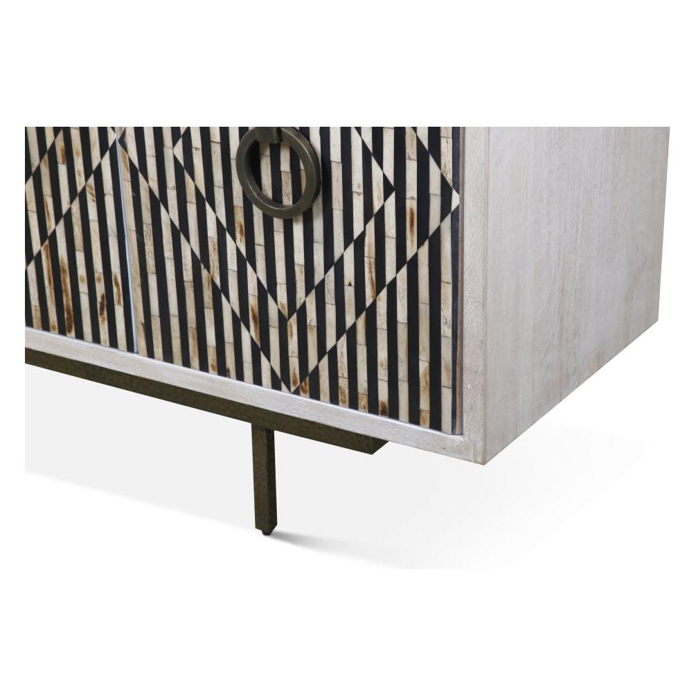 Close-up of the Terra Noir Sideboard Media Cabinet reveals its geometric black and wood-patterned front, featuring intersecting vertical black stripes with natural tones from horn and mango wood. It boasts a circular metal handle and dark metal legs for a bold, modern look.