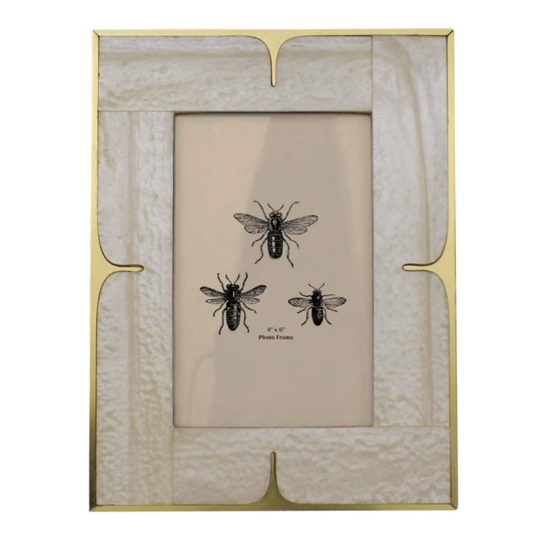 The Valmere Brass Inlay Photo Frame exudes refined elegance with its rectangular shape, gold metal border, marble-like corner texture, and beige center featuring three black bee illustrations in a triangular pattern. Timeless sophistication is showcased below the text "5" x 7" Photo Frame.