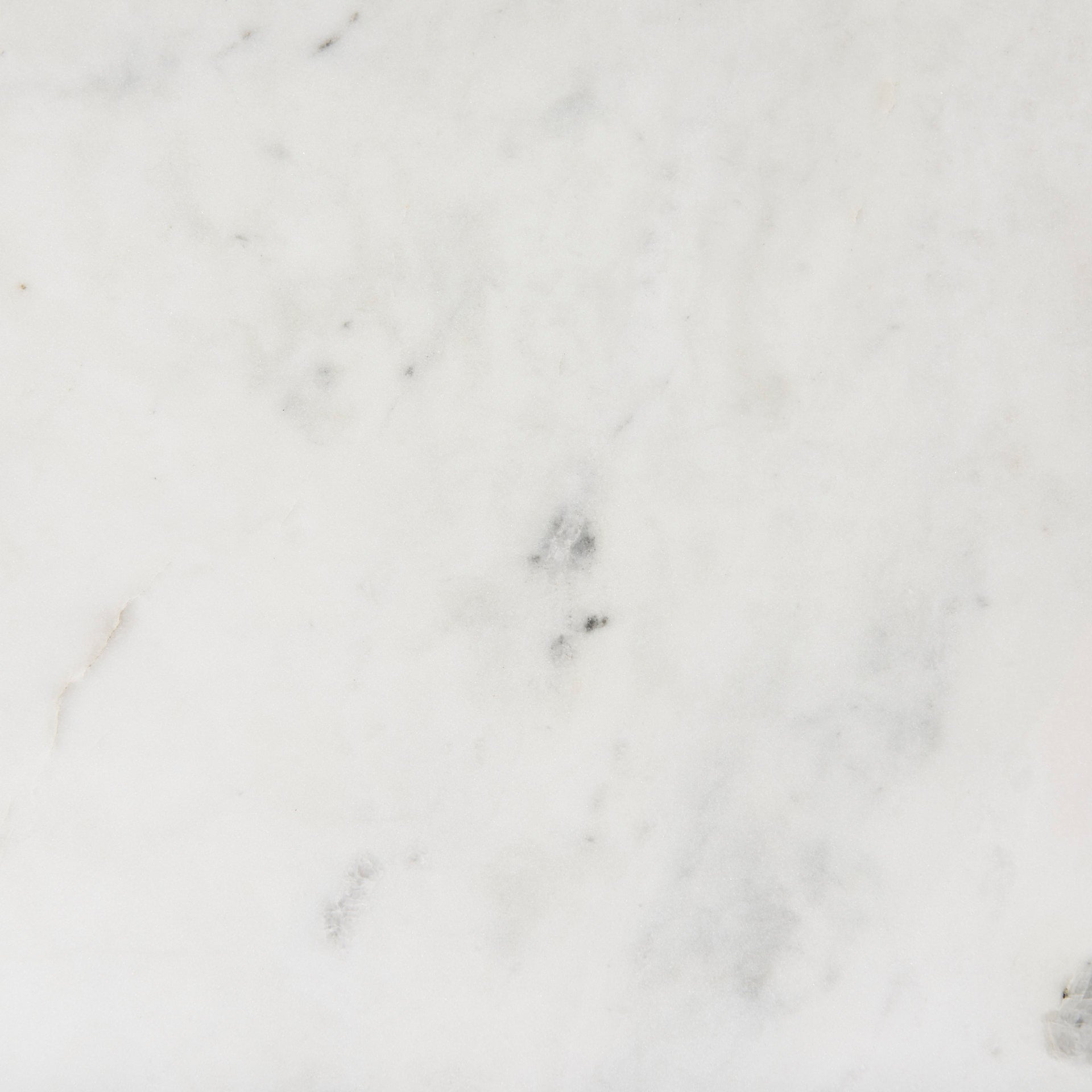 Close-up of a marble surface with a light gray color and subtle veining.