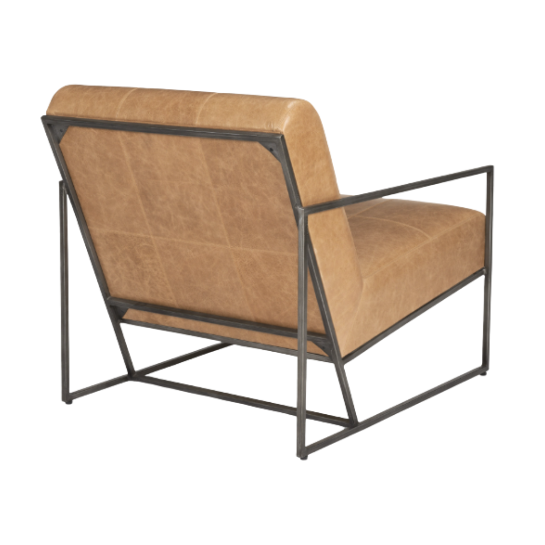 A rear view of the tan Vercelli Handcrafted Leather Accent Chair highlights its modern minimalist and industrial style, featuring a robust black metal frame with straight armrests and geometric design. The buffalo leather upholstery is smooth with subtle stitching for added texture.
