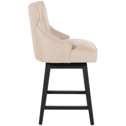 Side view of the Letty Swivel Counter Stool, Black, showcases modern beige biscuit polyblend upholstery with a high backrest and cushioned seat. It features a sleek black oak base with four sturdy legs and two sets of horizontal support bars.