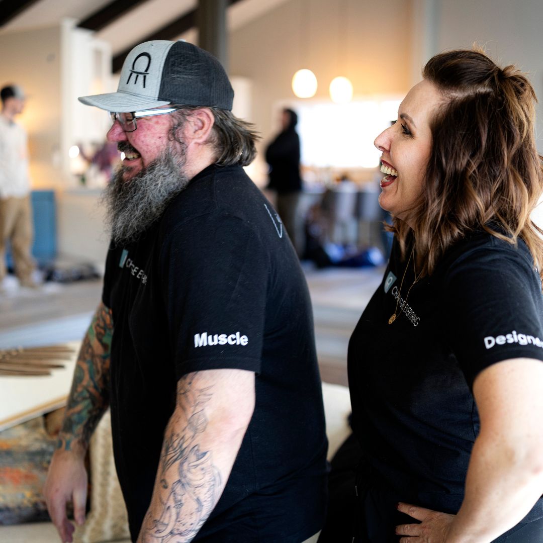 Interior designer Jaime Cawthron and a Change Everything delivery team member during final styling in a client’s home.
