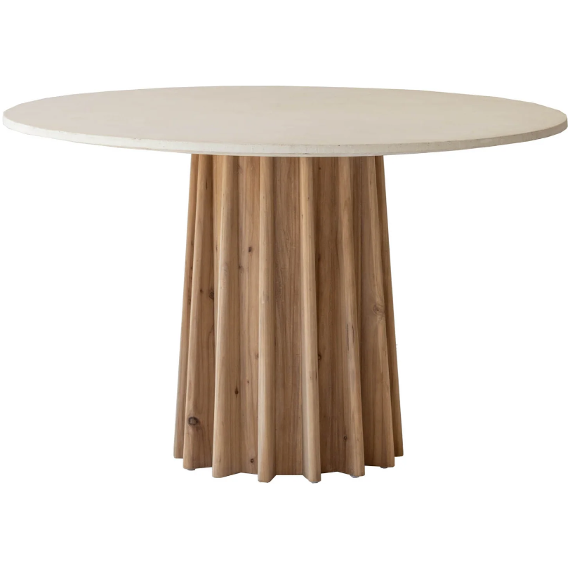 The Channel Concrete Dining Table features a round top crafted from sealed concrete and rests on a distinctive channeled oak wood base. The base showcases vertical wooden slats arranged in a circular pattern, delivering a textured and natural aesthetic. This table seamlessly blends modern design with rustic elements, making it a versatile addition to any interior space.