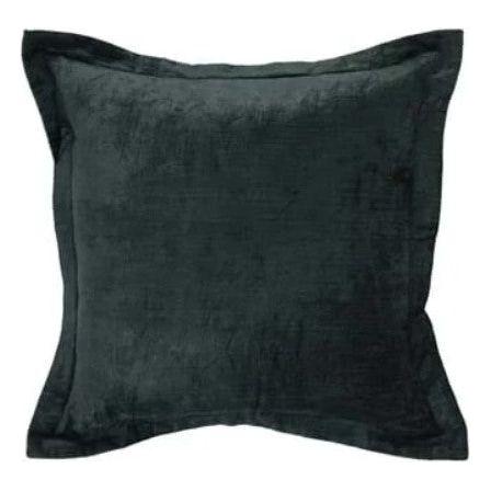 The Lapis Throw Pillow, available in six colors, is a square, dark green velvety pillow featuring a soft, plush texture for luxurious comfort. It is enhanced by a wide flange around the edges that creates a slightly ruffled appearance. The material's slight sheen adds an elegant touch, all set against a solid white background.