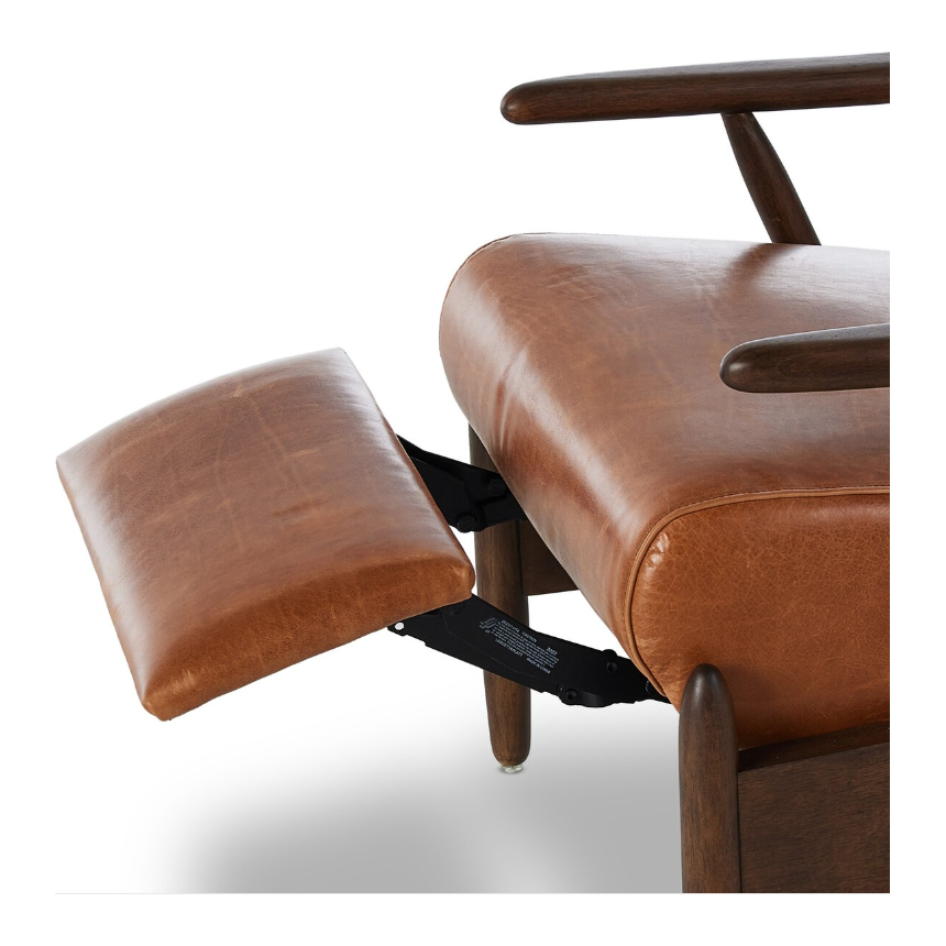 A close-up image of the Harrison Leather Recliner, showcasing premium leather upholstery in rich brown, complemented by a wooden frame with armrests. The chair features an extended, built-in footrest with matching leather, and its support mechanism is visible, highlighting sleek metal parts.