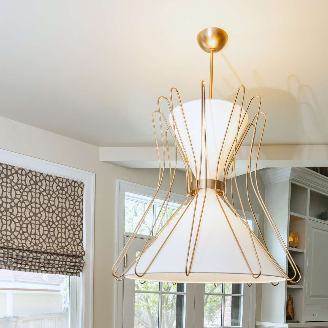Gold and white statement pendant selected for a coordinated decorative lighting plan