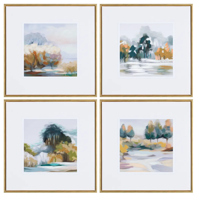 The Zion Collection consists of four hand-finished wall art pieces, each measuring 20x20 inches, showcasing abstract landscapes with brush strokes in muted colors. These scenes feature trees and water throughout the seasons, using shades of blues, greens, oranges, and browns. Each artwork is gracefully bordered with a gold frame that beautifully complements the white matting.