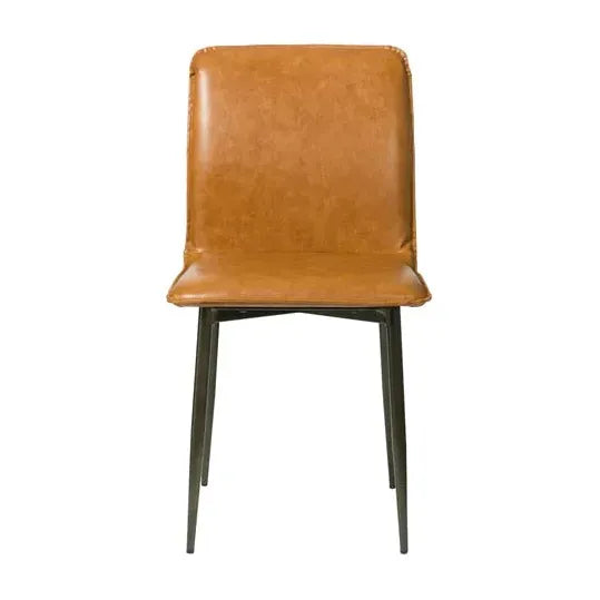 The Lucy Leather Dining Chair is displayed in tan leather with a high backrest and cushioned seat. It has a sleek black iron frame with four slightly outward-angled slender legs, embodying modern minimalism through its smooth leather texture and sleek structure.