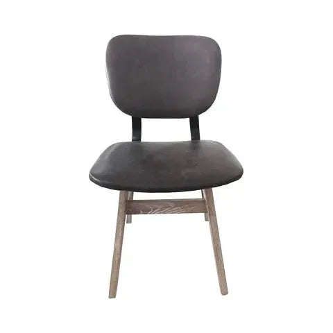 A Brown Leather Dining Chair with a dark grey cushioned backrest and seat. The backrest is slightly curved, and the chair has light wooden legs made from reclaimed wood that are angled outward, providing stability. This sustainable dining chair features a simple, minimalist design.