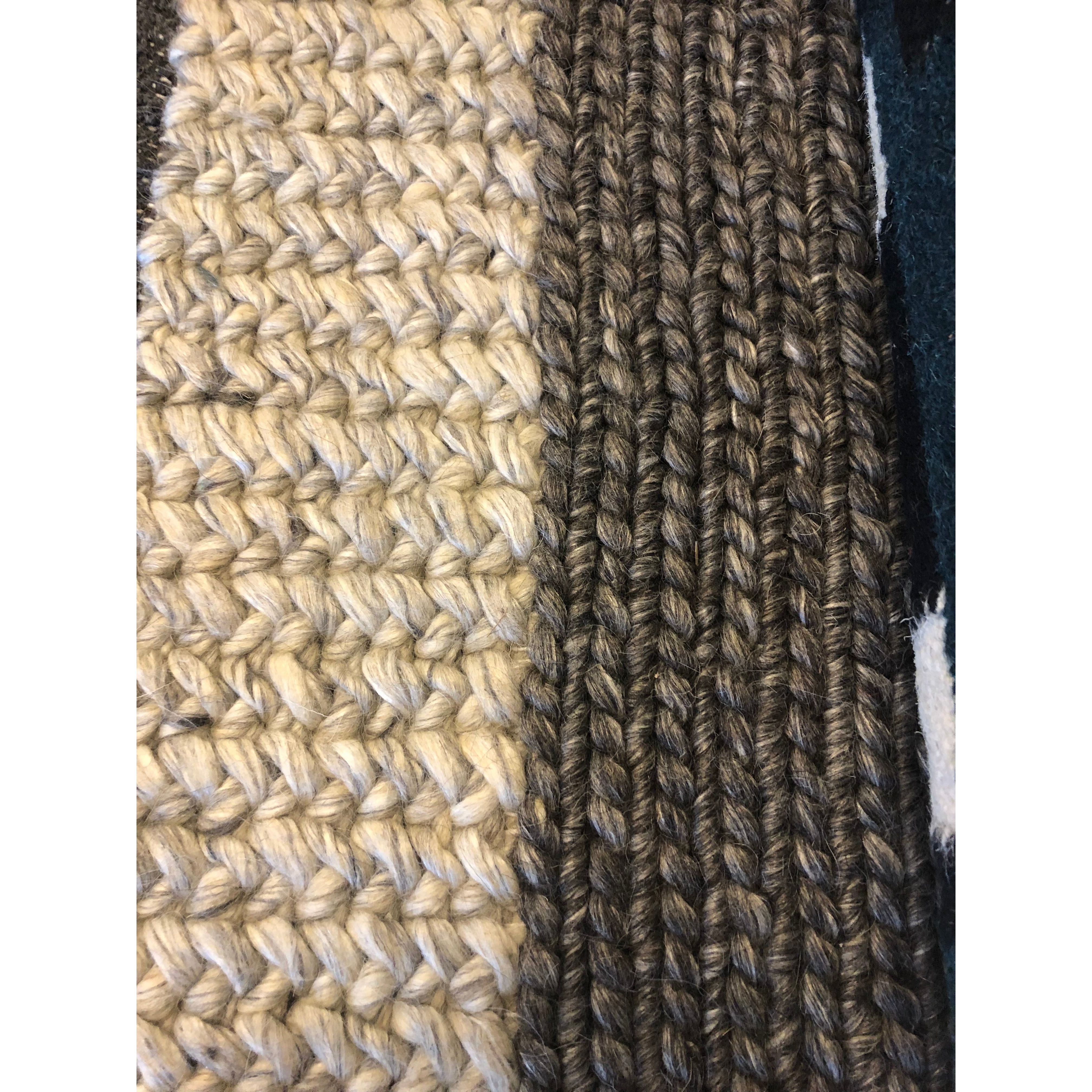 Close-up of two adjacent Forstel Wool Rug patterns: on the left, a chunky beige and off-white braided texture; on the right, a tighter dark brown and tan rope-like weave. The contrasting tones and weaving styles highlight distinct craftsmanship.