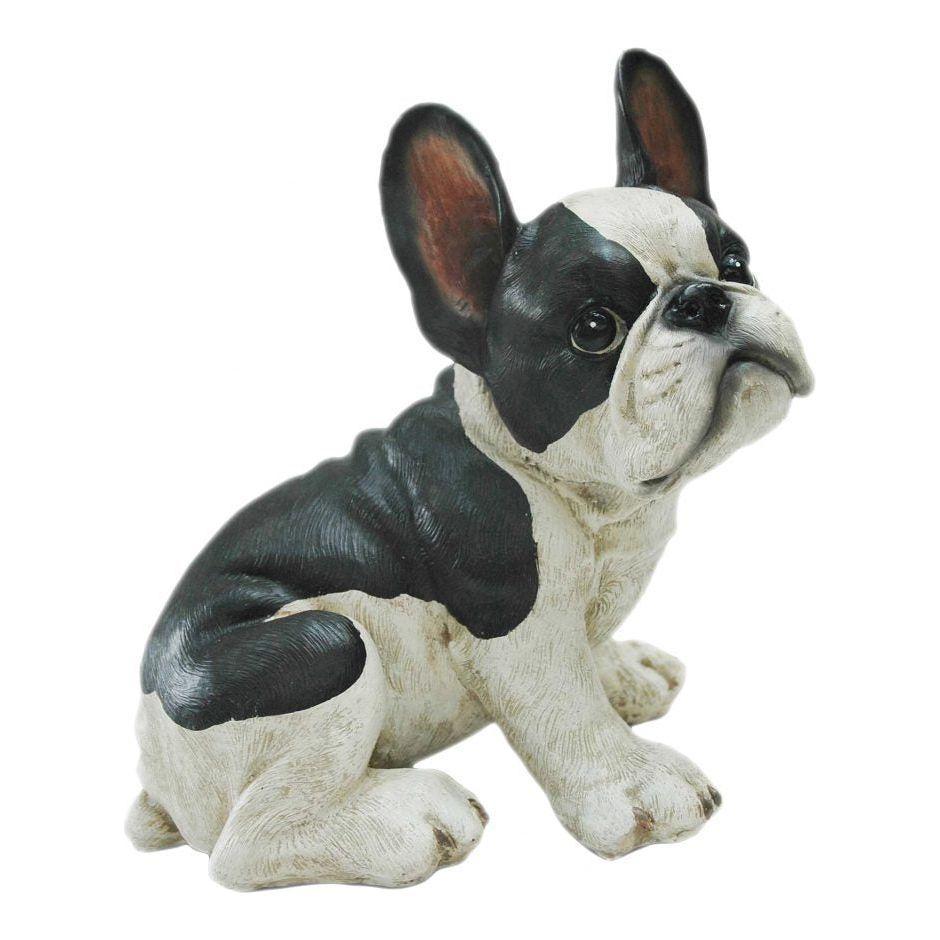 Fred the Dog is a detailed sculpture of a sitting French Bulldog, featuring a black and white coat, large upright ears, and a curious expression. The realistic texture in the fur and features showcases skilled craftsmanship.