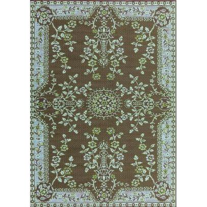 The Outdoor Rug Oriental Garden is an intricately designed brown and white floral rug made from recycled materials. This eco-friendly masterpiece showcases symmetrical arrangements of flowers, leaves, and vines with a central medallion. Its edges feature a repeating floral motif, creating a harmonious and elegant pattern throughout.
