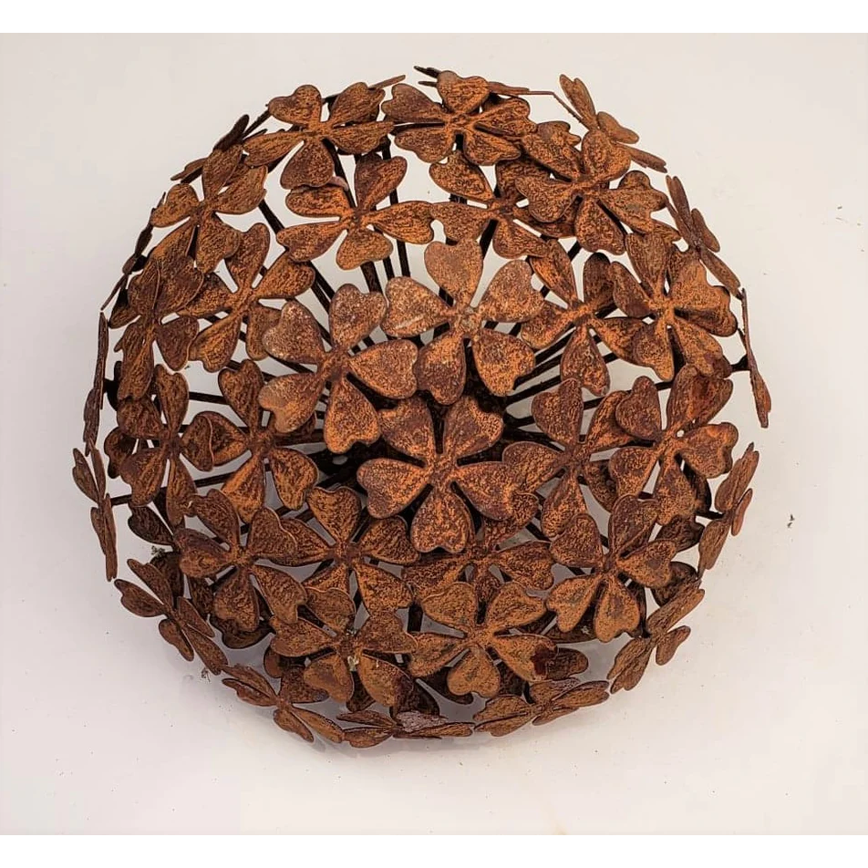 The Rust Hydrangea Metal Flower sculpture features heart-shaped petals in a rust color, exemplifying elegant craftsmanship. The intricately arranged flowers create a dense, textured pattern for an appealing three-dimensional effect. It is perfect as an outdoor decoration against a plain white background to accentuate its details.