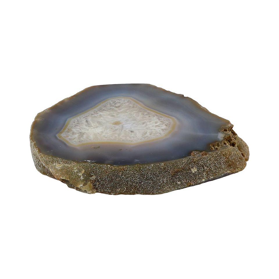 A close-up image of the Thick Agate Slab. The outer edge is textured and rough in brown shades, while the interior reveals a smooth, glossy surface with concentric rings of bluish-grey and white, surrounding a crystalline center. The decorative stone is placed against a plain white background.
