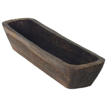 The Paulownia Display Trough is a rectangular rustic wood bowl with thick sides and a rough, uneven texture. Its hand-carved interior shows natural grain, slight imperfections, and signs of craftsmanship. Set against a white background.