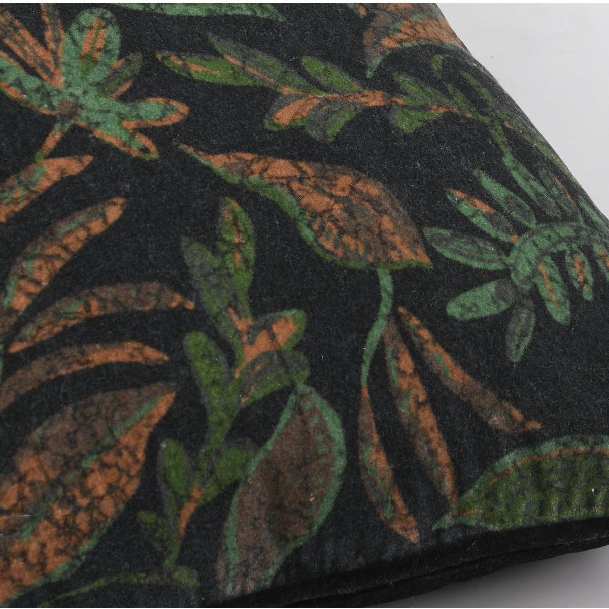 Close-up of the Emerson Black/Multi Throw Pillow, featuring plush velvet fabric with a dense botanical pattern of green and brown leaves on a black background for a soft, textured look.
